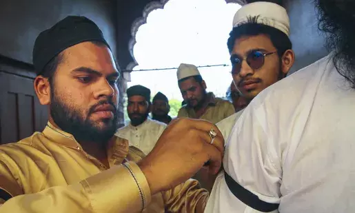 Wearing black badges in protest against Waqf Bill